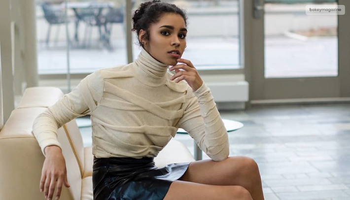 A Turtle Neck With A Leather Skirt